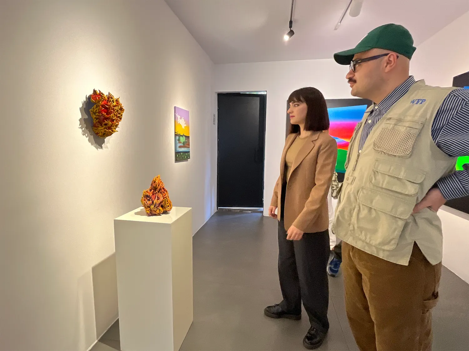 Exhibition view with the artist and audience. In Search of the Wild Orchid, 2024, Nian Art Gallery, Tehran, Iran.